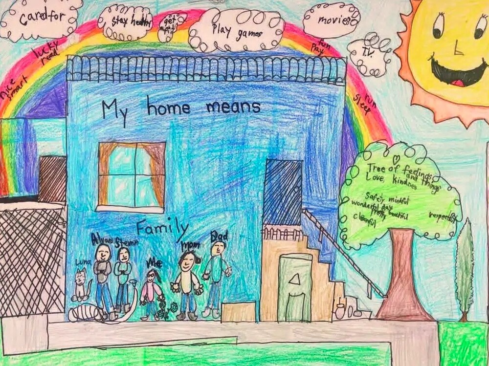 What Home Means to Me Poster Contest Winner, July 2024. The artist and their family surrounded by items that mean home to the artist.